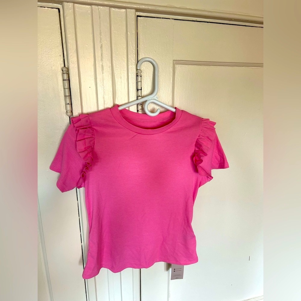 Pretty in Pink! Ribbed, form fitting, short sleeve shirt.